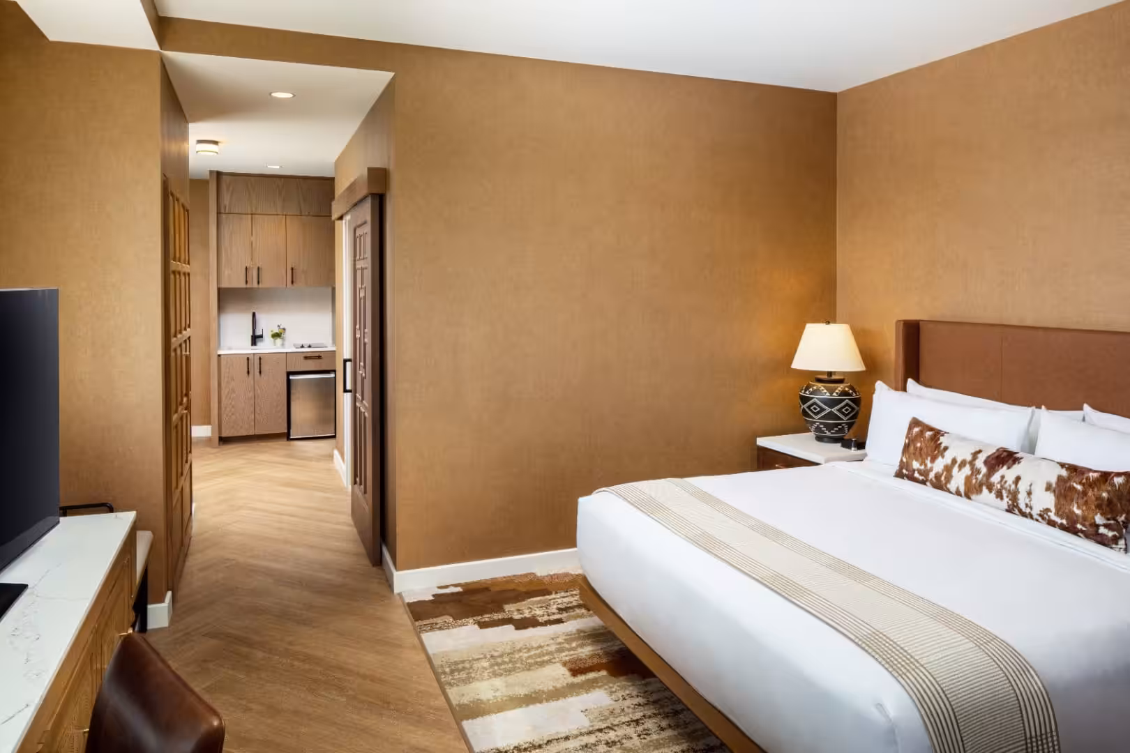 Spacious hotel suite with king bed and kitchenette